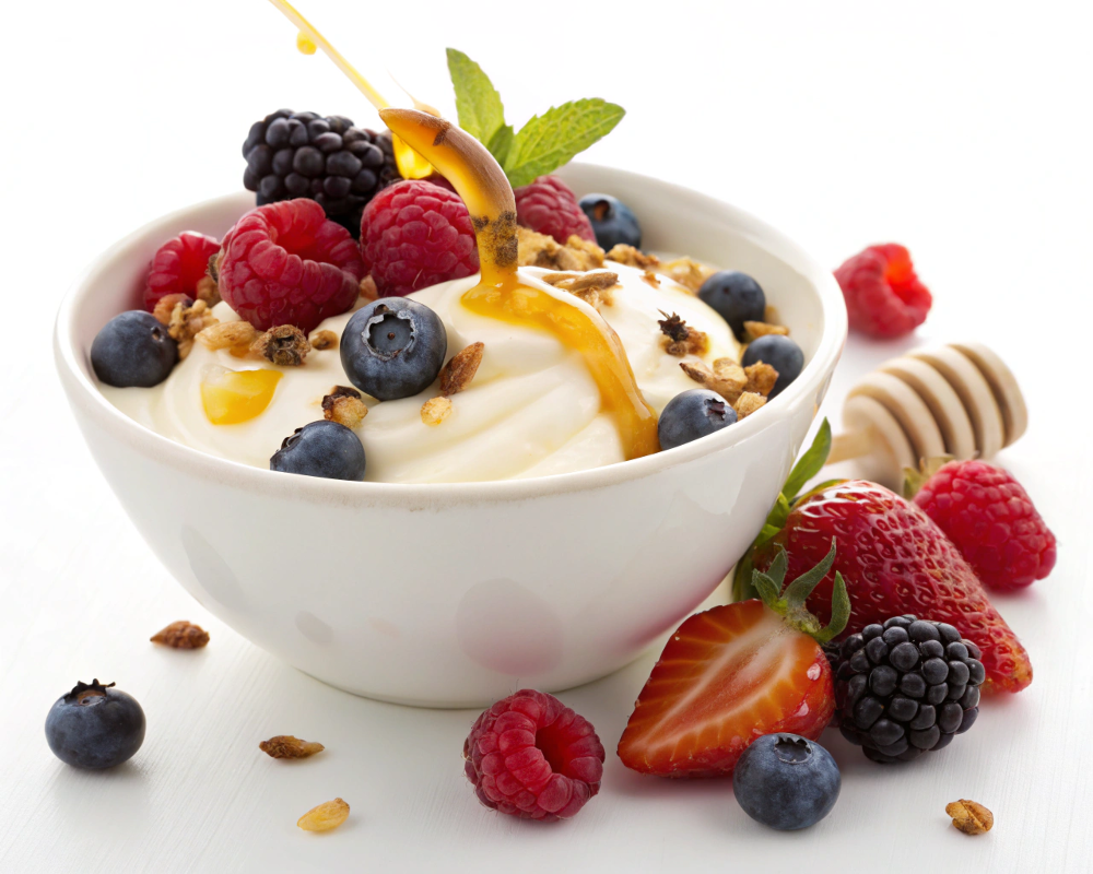 Healthy breakfast featuring Greek yogurt with fruit under 300 calories.